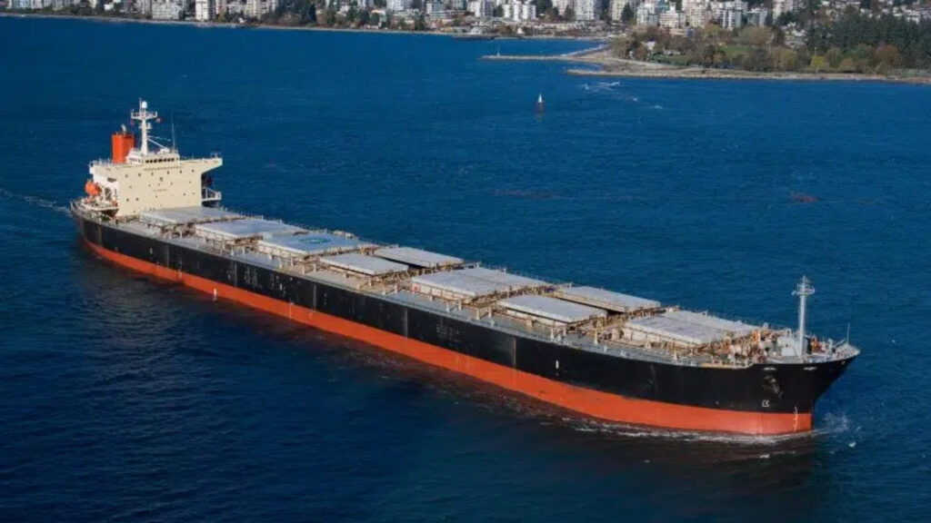 Cargo ship carrying electronic shipment sailing departing from a port