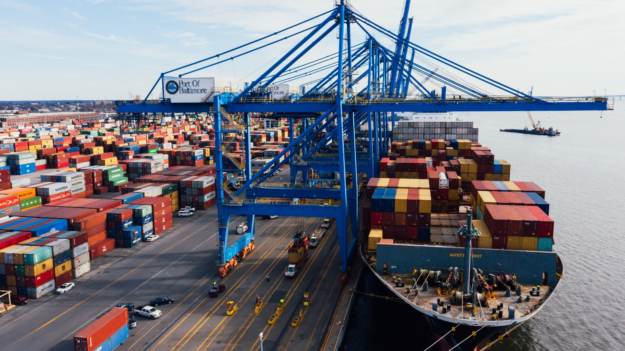 Cargo ship docking at Port of Baltimore with cranes