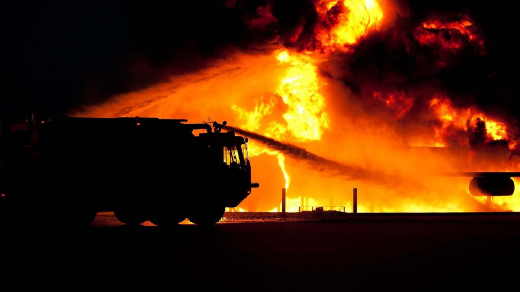 Fire engine shooting water on a fire
