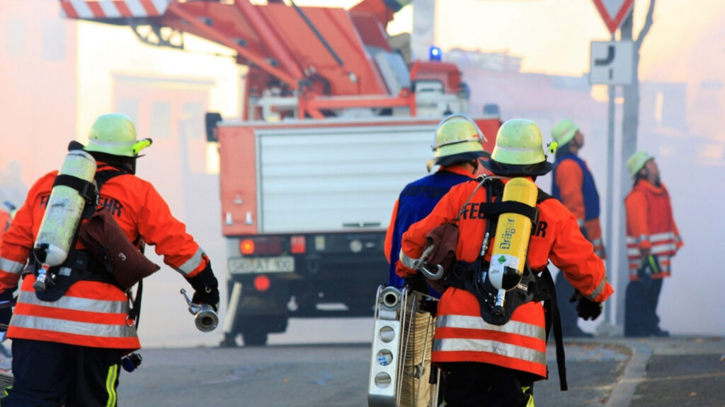 Fire fighters with a fire engine