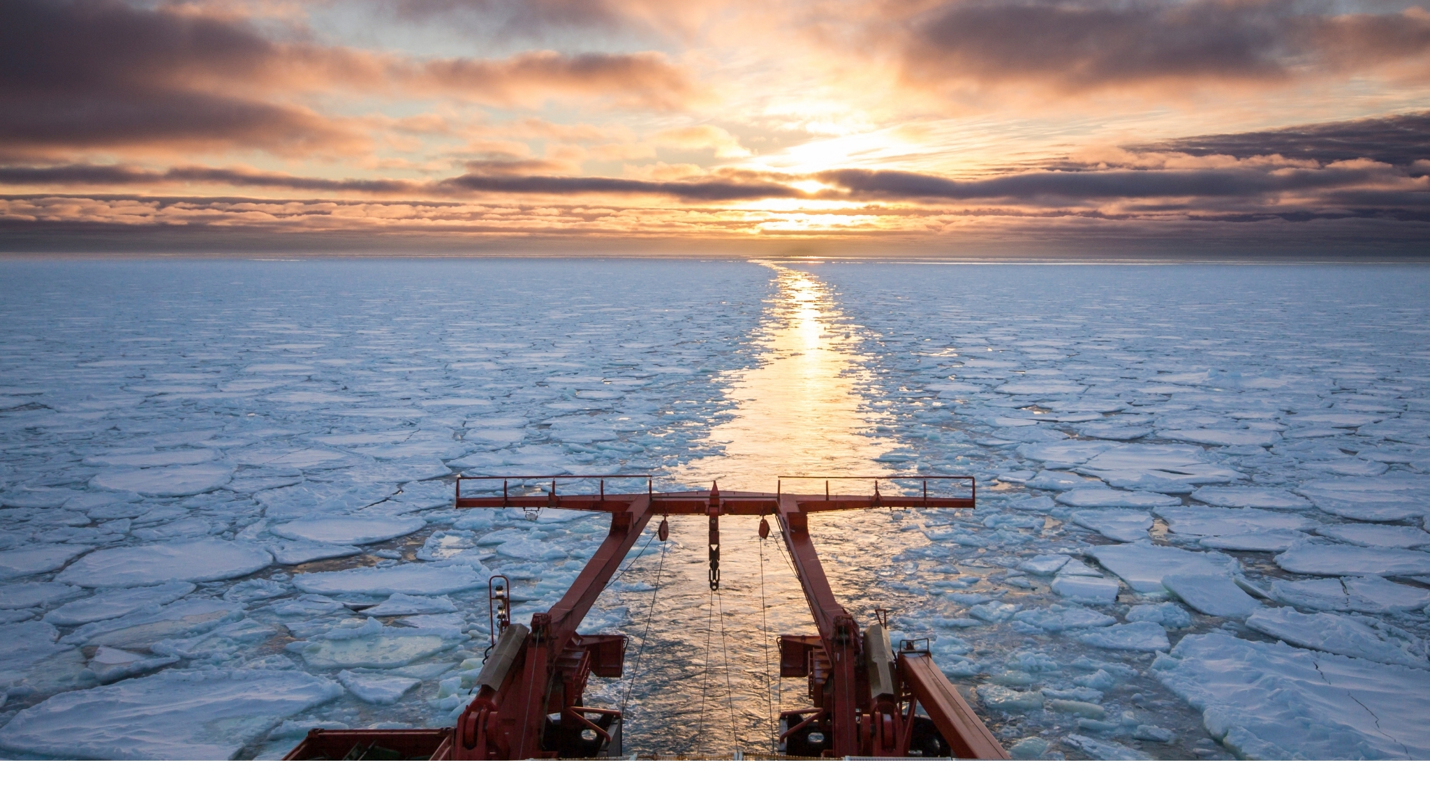 Research ship sailing in icy seas