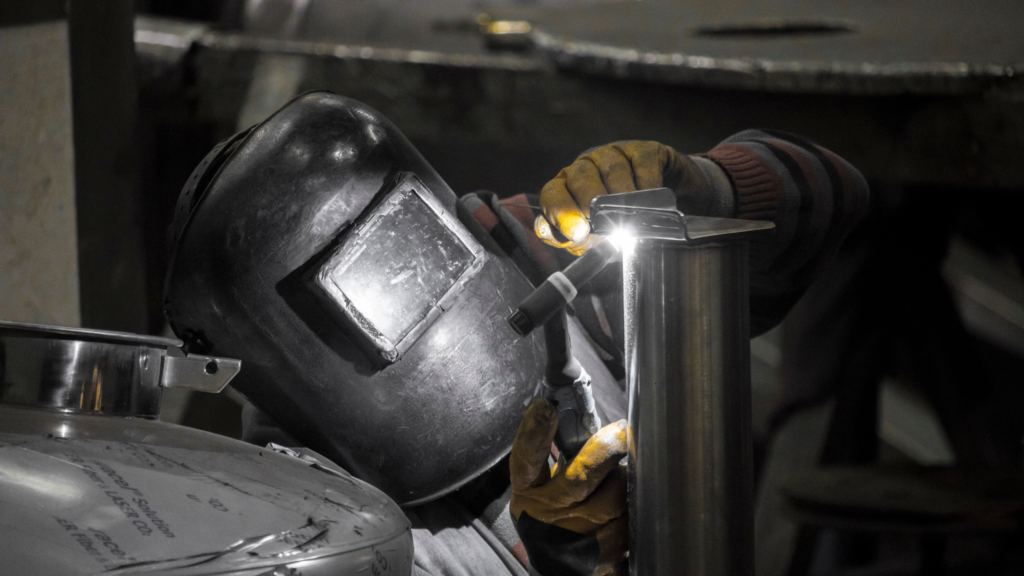 A Worker in a Mask inspecting