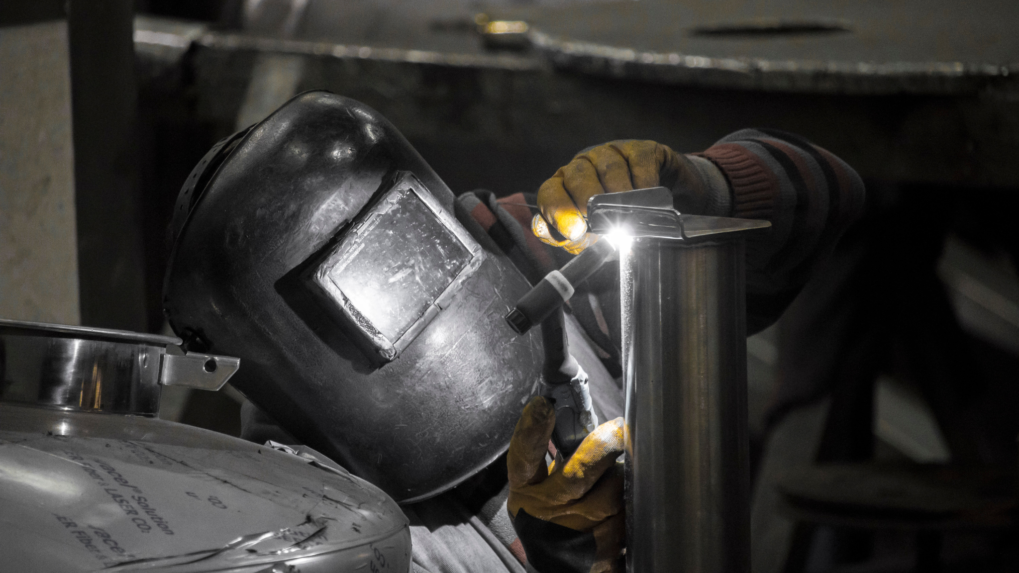 A Worker in a Mask inspecting