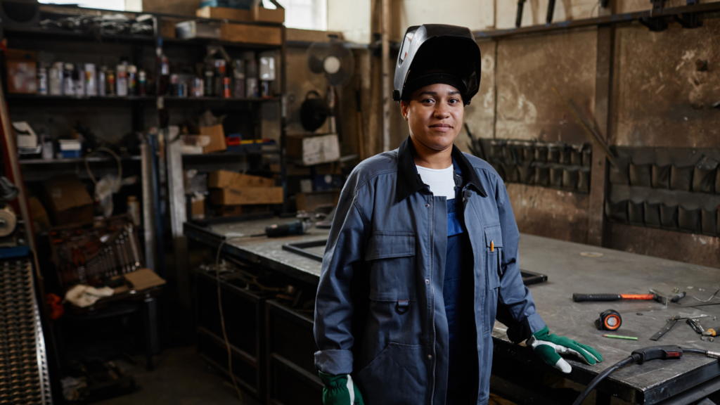 A Worker in a Welding Workshop