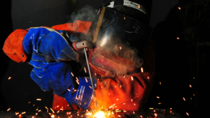 Welding Work by a Worker in Orange