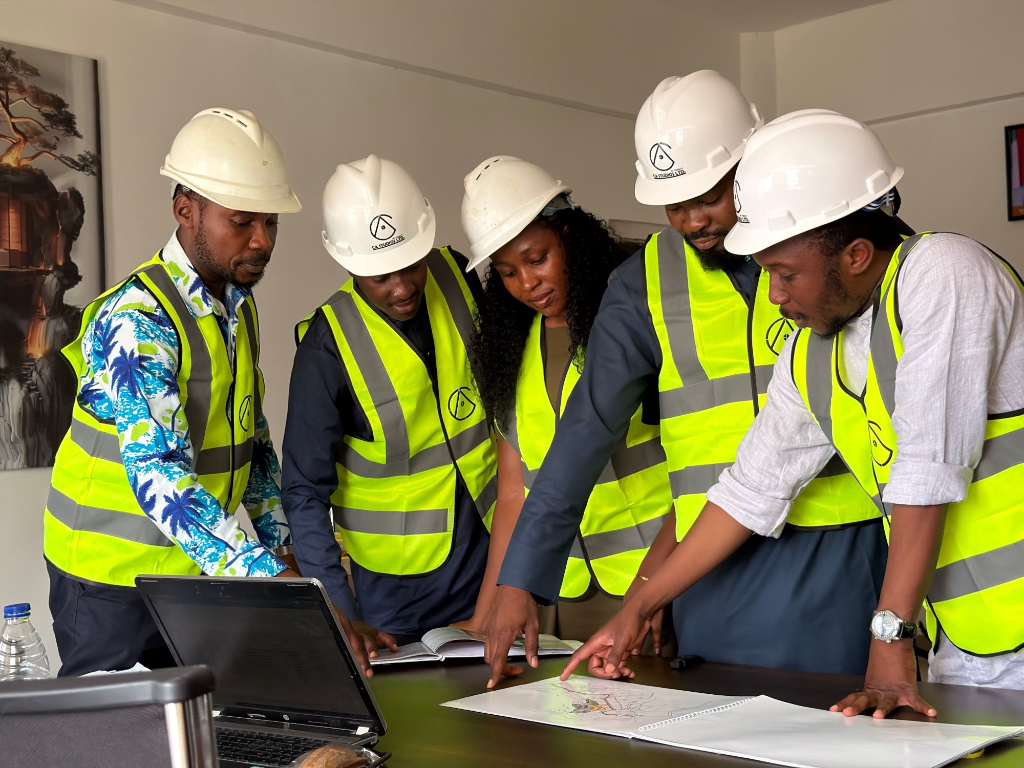 Team reviewing drawings on site