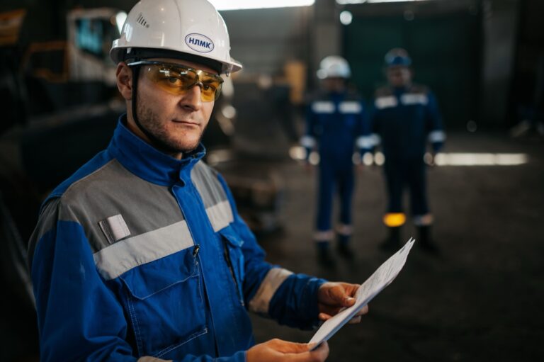 An engineer reviewing technical documentation